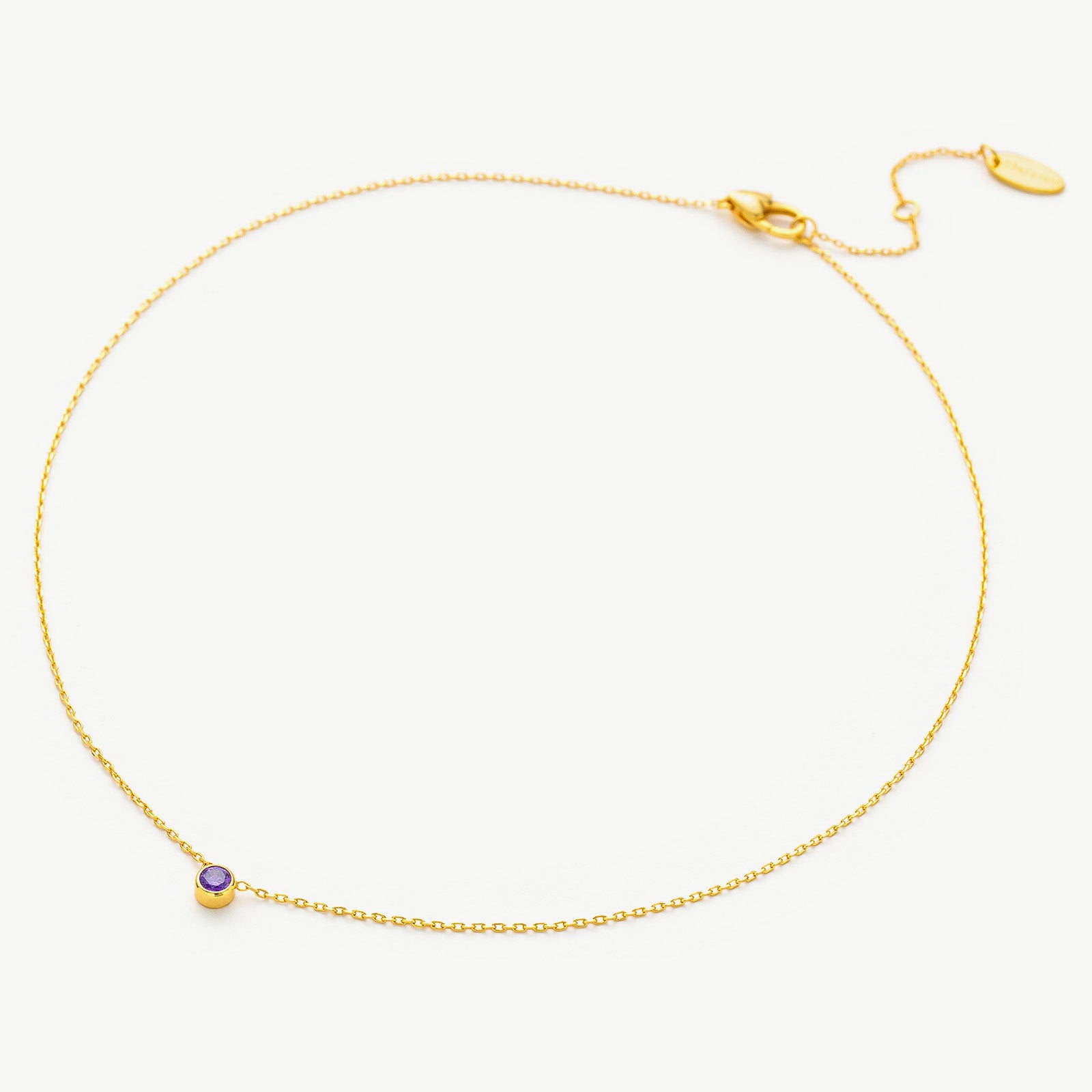 Gold Spinel Purple Crystal Pendant Necklace, showcasing a regal spinel purple crystal pendant on a delicate gold chain, adding a touch of elegance to your style
