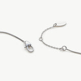Platinum Crystal Drop Necklace in Sapphire, an enchanting sapphire glow that radiates elegance, featuring a crystal drop pendant in a deep blue hue, creating a timeless and stylish accessory