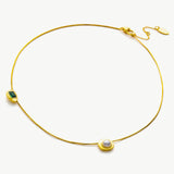  Crystal Drop Necklace in Gold with Emerald, unveiling the elegance of emerald, this necklace features a mesmerizing crystal drop in a vibrant green hue on a delicate golden chain, expressing timeless beauty and style
