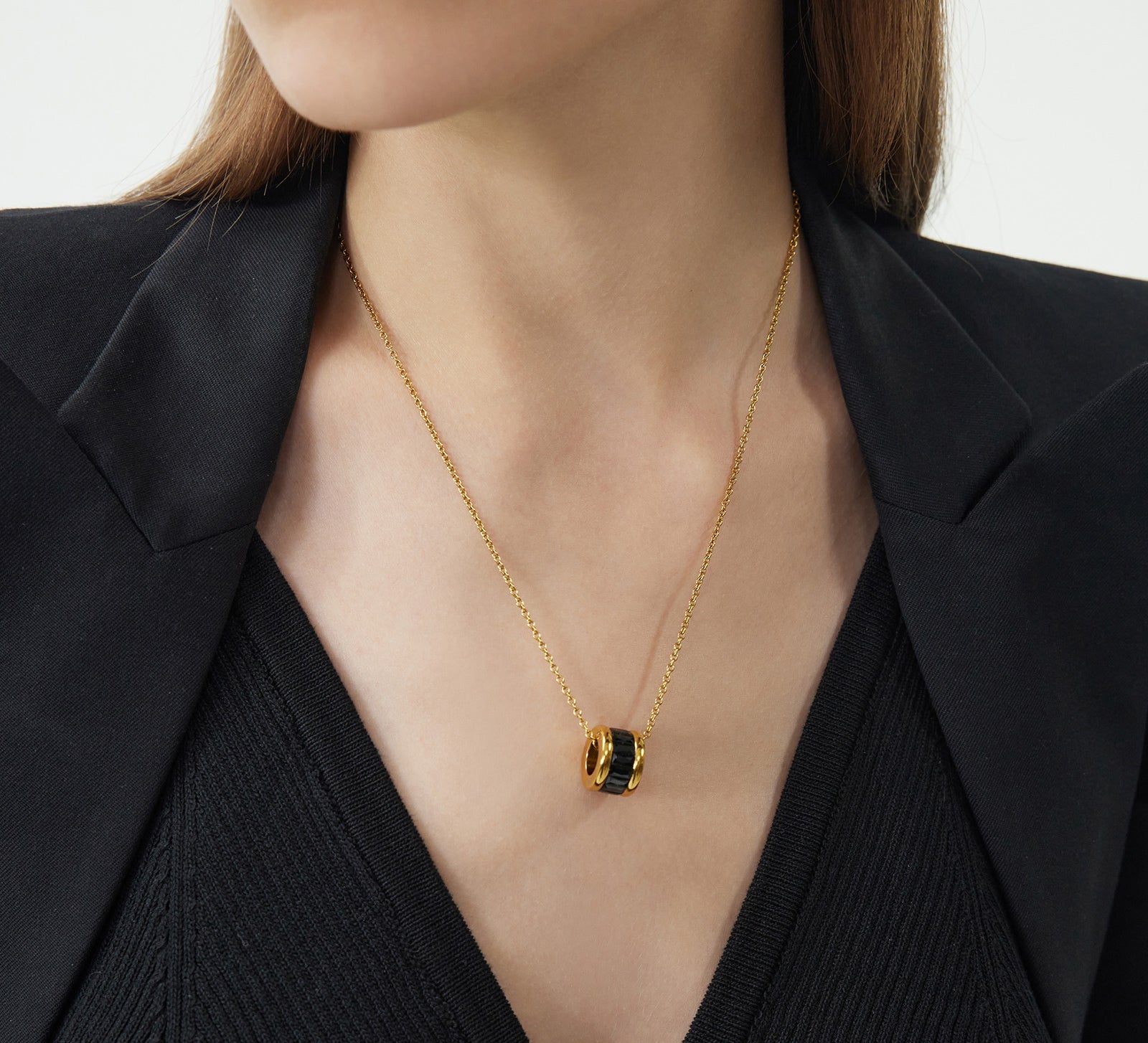 Ring Pendant Chain Necklace in Black, a minimalist and noir-inspired piece, this necklace features a black ring pendant suspended from a dainty chain, creating a subtle and modern accessory for everyday wear