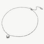  Heart Pendant Necklace in Platinum, symbolizing opulent platinum beauty, this necklace features a captivating heart-shaped pendant suspended from a delicate platinum chain.