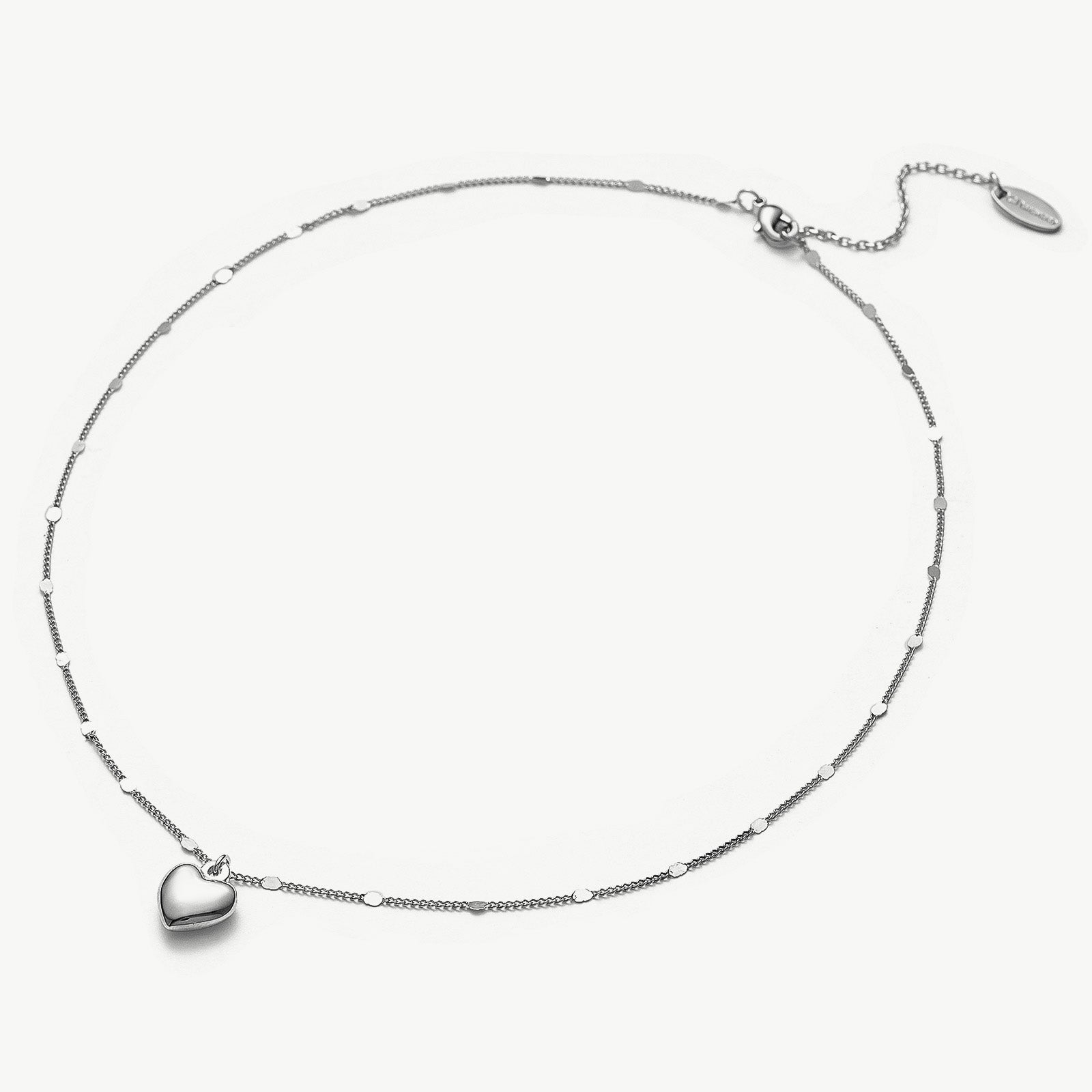  Heart Pendant Necklace in Platinum, symbolizing opulent platinum beauty, this necklace features a captivating heart-shaped pendant suspended from a delicate platinum chain.