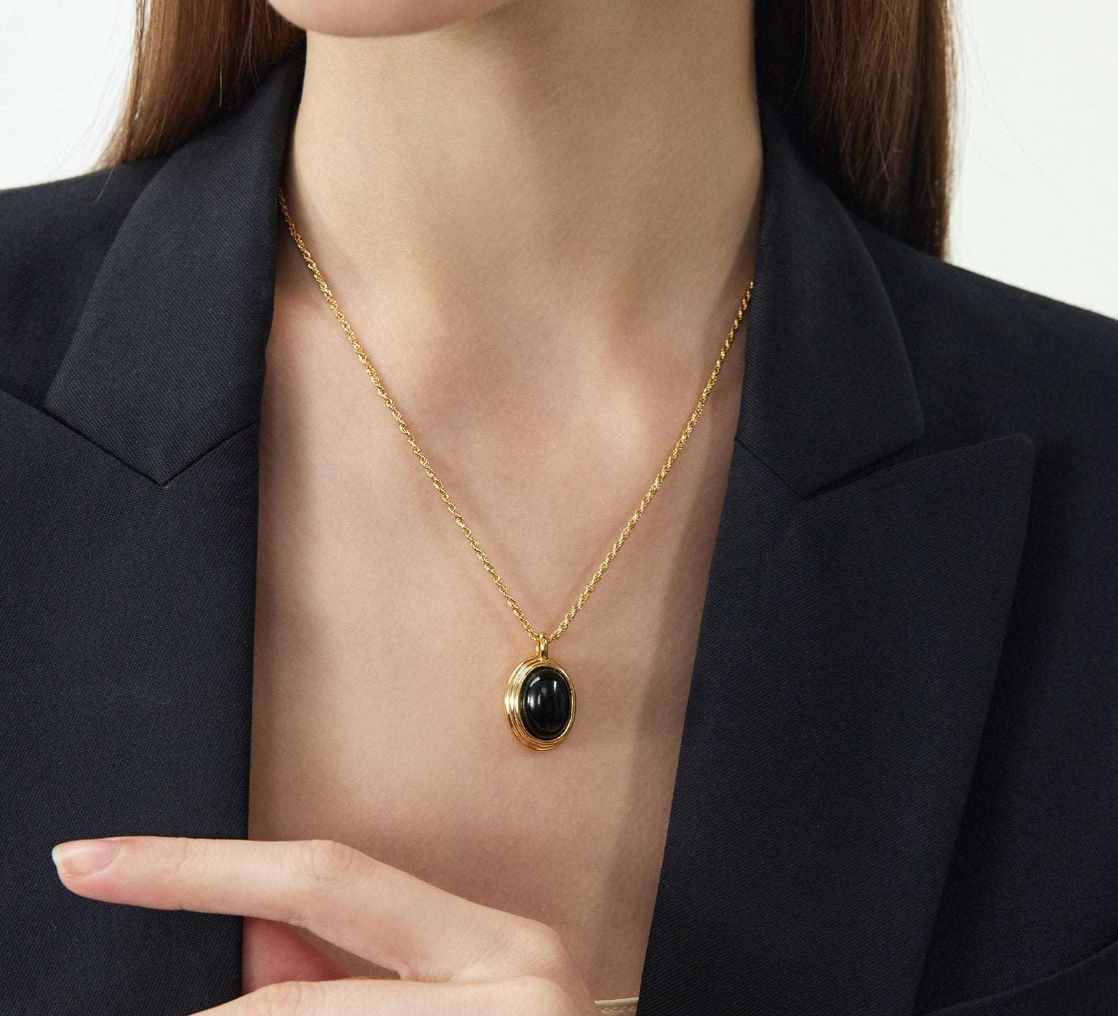 Luxe Black Gleam: Gold Pendant Necklace with Black Agate, with a luxe black gleam, this necklace captures the allure of black agate in a gold setting, adding a touch of opulence and sophistication to your neckline
