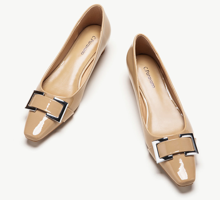 Pair of beige low-heels closed-toe shoes