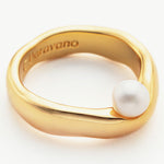 Stacking Ring featuring a delicate pearl, perfect for elevating your look with understated charm