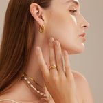  Stacking Ring adorned with a lustrous pearl, offering a modern and elegant twist to your everyday style