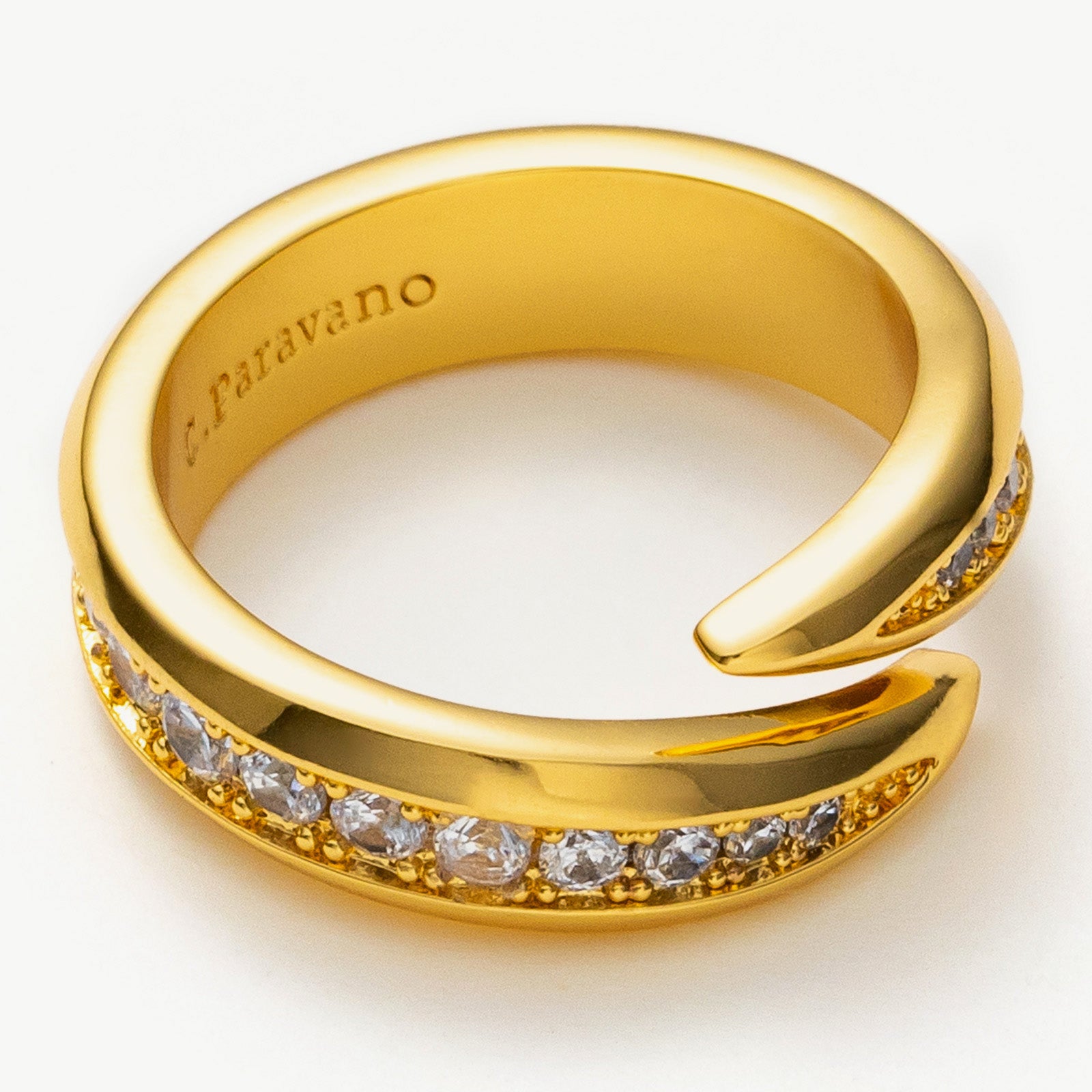 Gold Crystal Ring, showcasing a modern and intricate crossover pattern with shimmering crystals