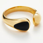  Sculptural Onyx Ring in black, a sleek and sculpted design that adds a touch of urban sophistication to your look