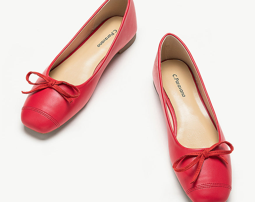    Red-suede-toe-ballet-flats-with-a-charming-bowknot-accent_-perfect-for-a-stylish-look.