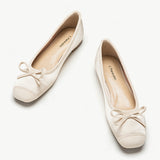 Silky-ivory-ballet-flats-with-an-elegant-bowknot-detail_-perfect-for-a-refined-look