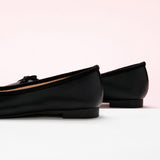 Sleek-black-ballerina-flats-featuring-a-cute-bowknot-accent-for-added-flair