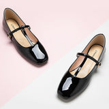 Sleek-black-crossed-strap-flats-offering-both-style-and-comfort-for-everyday-wear.