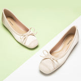 Sophisticated-ivory-bowknot-ballet-flats-featuring-a-silky-texture-for-added-charm.