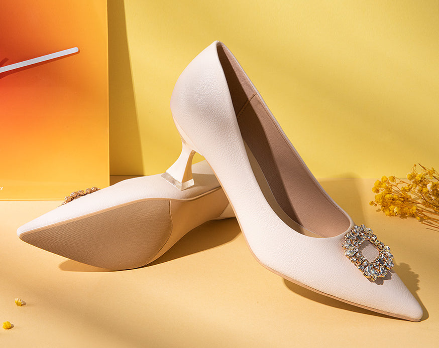 Striking-white-leather-pumps-with-exquisite-embellishments_-exuding-a-sense-of-elegance-and-luxury