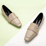 Stylish camel loafers in an urban setting
