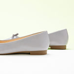 Stylish-grey-ballet-flats-with-a-delightful-bowknot-detail-and-a-soft-suede-toe.