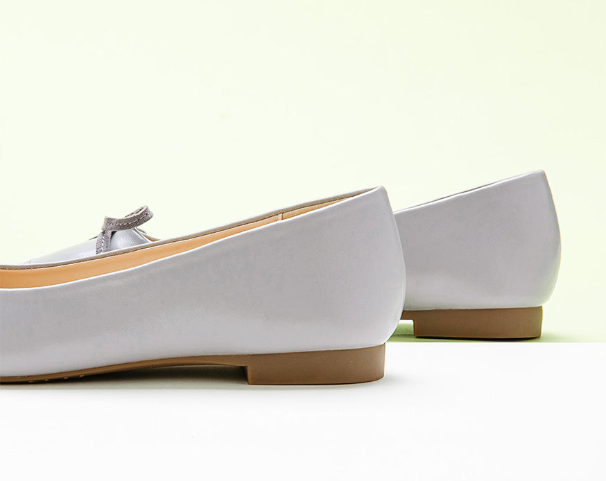 Stylish-grey-ballet-flats-with-a-delightful-bowknot-detail-and-a-soft-suede-toe.