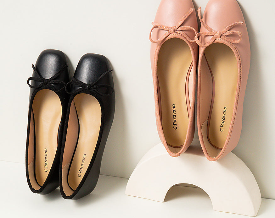 Stylish-pink-ballet-flats-enhanced-with-a-graceful-bowknot-embellishment-for-a-fashionable-look.