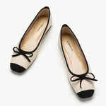 White-suede-toe-ballet-flats-with-a-graceful-bowknot-accent_-perfect-for-a-timeless-look.