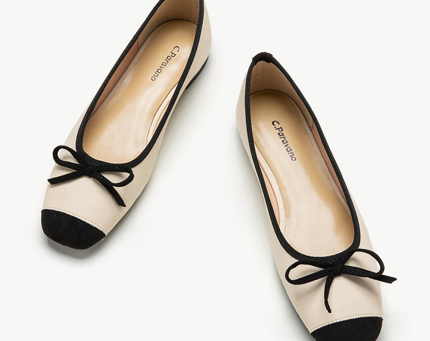 White-suede-toe-ballet-flats-with-a-graceful-bowknot-accent_-perfect-for-a-timeless-look.