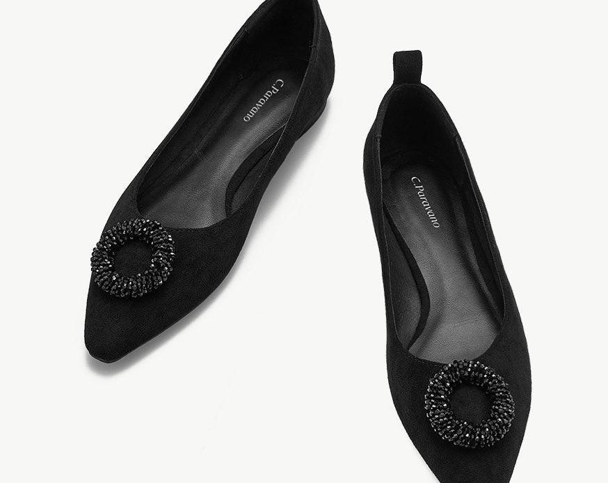 Black point-toe suede flats for a sleek and stylish look.