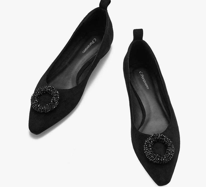 Black point-toe suede flats for a sleek and stylish look.