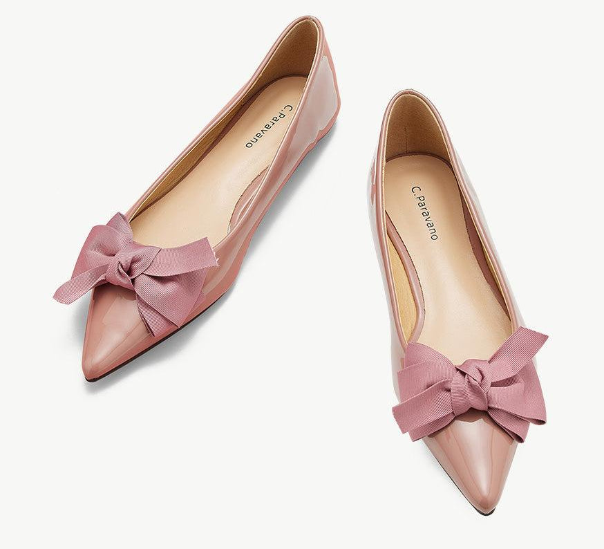 Elegant pink Point Toe Flats in glossy patent leather, a graceful and fashionable choice