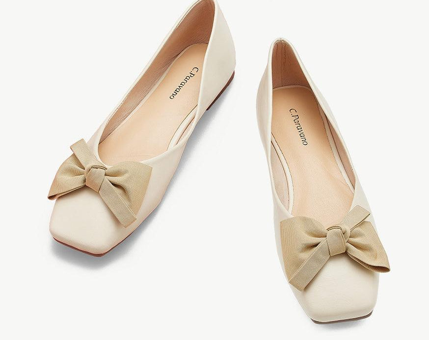 A pair of vibrant whitel bowknot square flats for a bold and stylish look