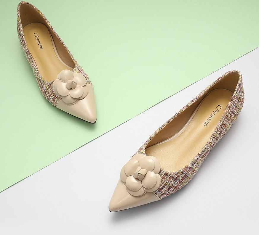 Classic beige tweed flats adorned with a charming camellia design