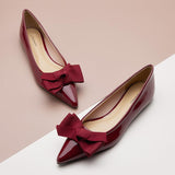 Vibrant red Point Toe Flats in glossy patent leather, a chic choice for any occasion