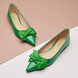Elegant green Point Toe Flats in glossy patent leather, a fresh and stylish choice.