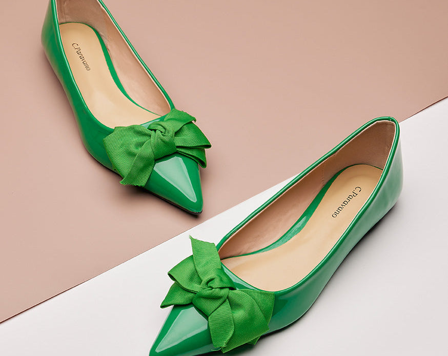 Elegant green Point Toe Flats in glossy patent leather, a fresh and stylish choice.