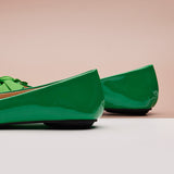 Stylish green Patent Leather Flats with a pointed toe, a fashion-forward statement.
