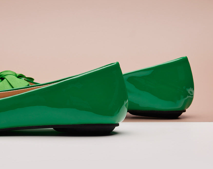 Stylish green Patent Leather Flats with a pointed toe, a fashion-forward statement.