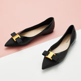 Classic black flats in genuine leather with tasteful adornments