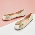 Elegant white metal bowknot square flats, perfect for a fashionable appearance.