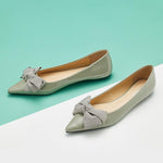 Chic green Patent Leather Flats with a pointed toe, a symbol of sophistication