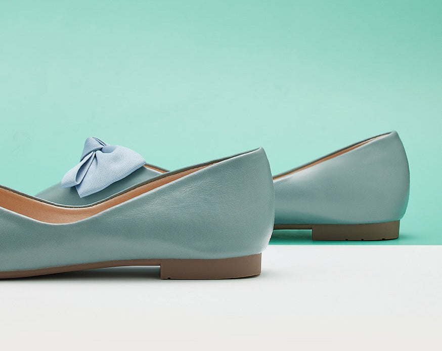 Blue bowknot flats - a versatile and fashionable addition to your footwear collection.