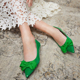 Vibrant green Point Toe Flats crafted from patent leather, a fashionable addition to your wardrobe
