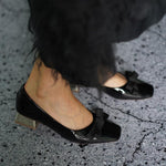 Sleek Black Patent Leather Pumps with a Medium Hee