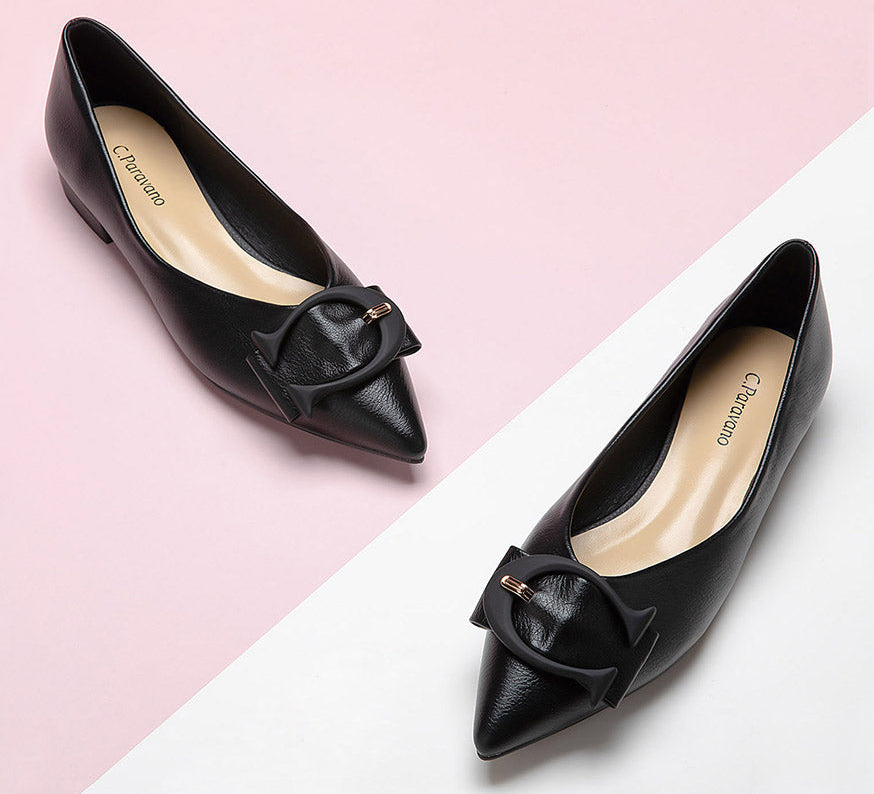 Elevate your style with black grain leather point-toe flats.