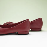 Red grain leather flats with a stylish pointed toe design