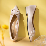 Elevate your style with white grain leather point-toe flats.