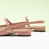 Sleek Pink Slingback Flats: Step out in style with these refined pink flats featuring a pointed toe and slingback design.