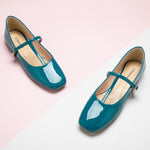 Patent Crossed Stripe Mary Jane shoes in a serene blue hue, a stylish and vibrant choice for a touch of the sea