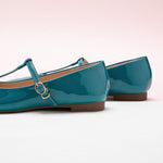  Blue Patent Mary Jane with Crossed Stripes, adding a touch of modernity and style to your ensemble.